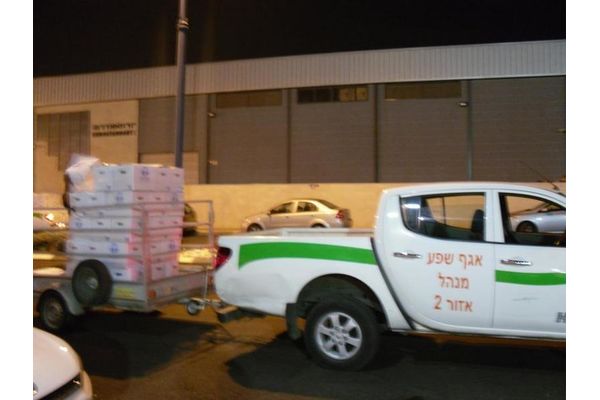 חלוקת מזון לנזקקים בשנה שעברה שעליה פקד רמי מדהלה